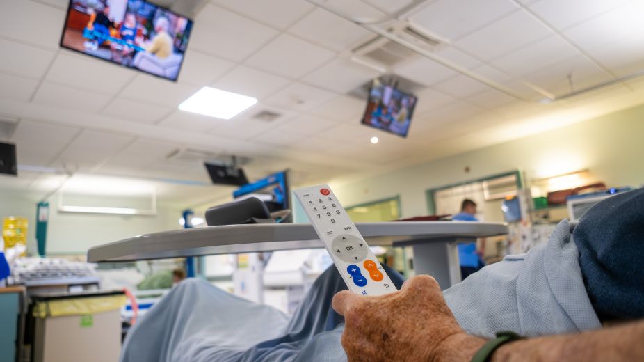 Ray Gilpin with TV remote receiving dialysis 