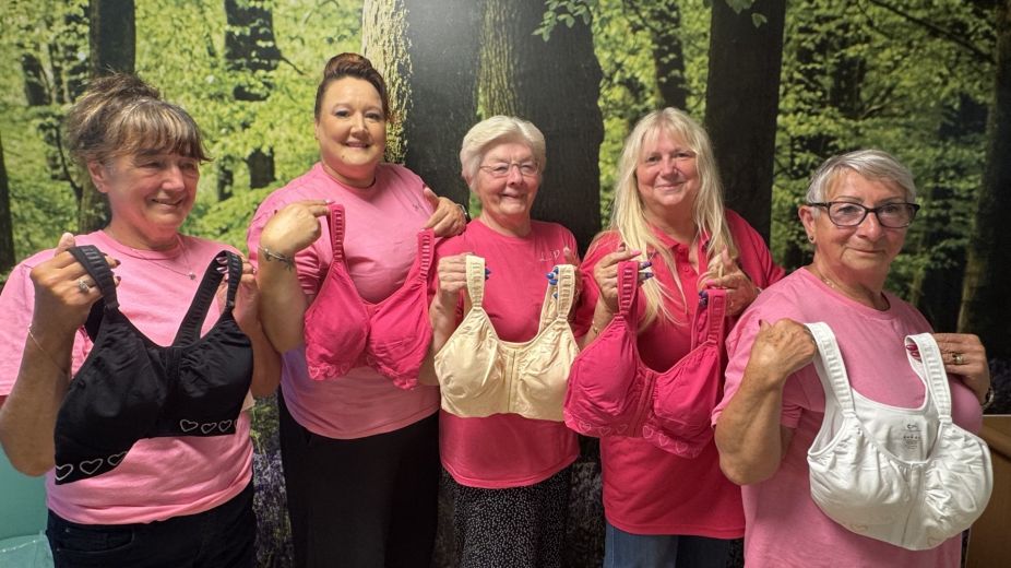 Ladies holding up post mastectomy bras