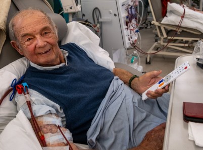 Ray Gilpin with TV remote receiving dialysis