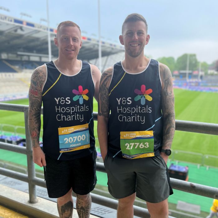 Jordan Mintoft and Jo Logan in their charity vests. 