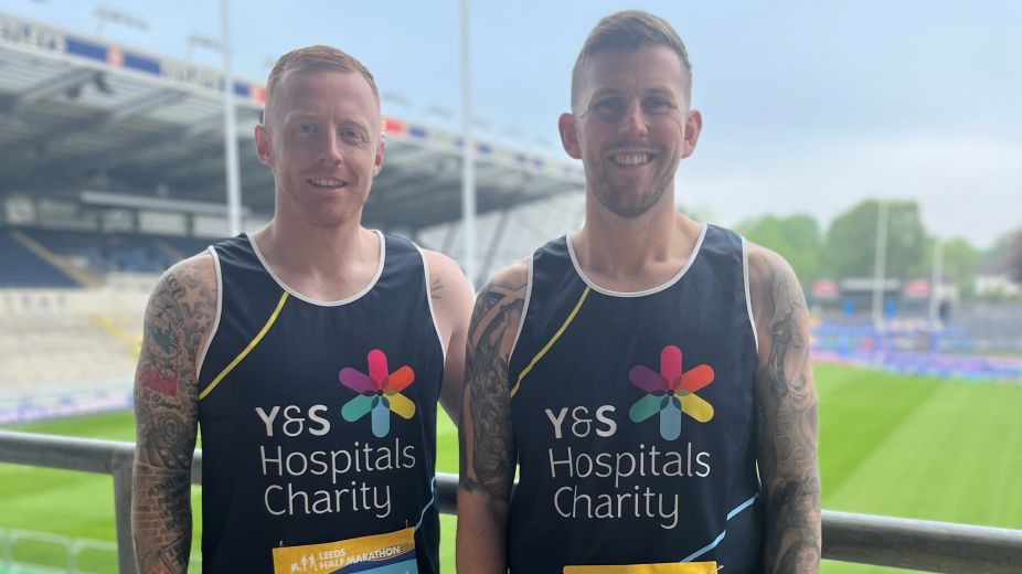 Jordan Mintoft and Jo Logan in their charity vests. 