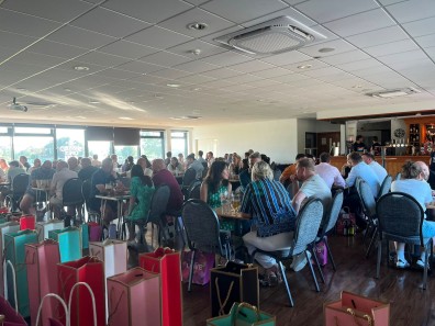 image of participants sitting around tables