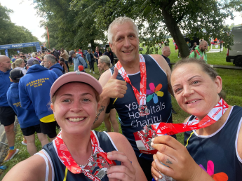 Sarah and her husband at a running event 