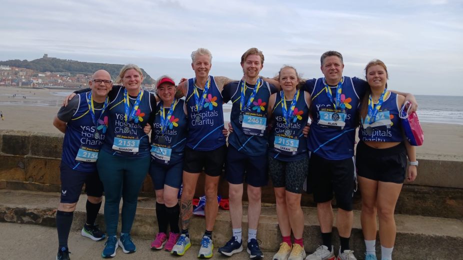a group of runners with their Yorkshire Coast 10k medals