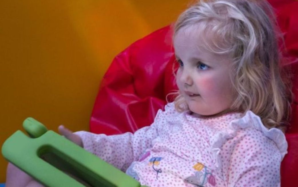 young patient playing with ipad