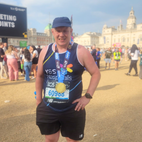 Runner Alex with his medal after finishing the london marathon