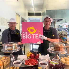 Staff holding NHS Big Tea Sign