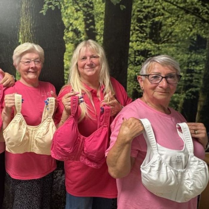 Ladies holding up post mastectomy bras