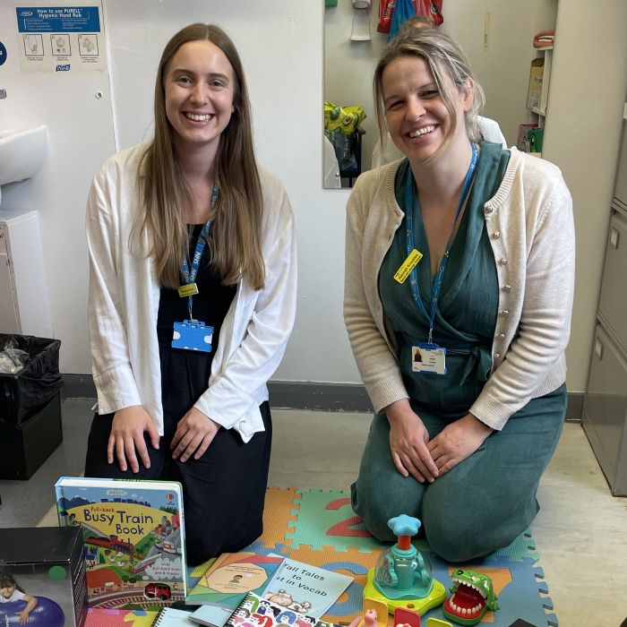two community nurses sat with the education aids