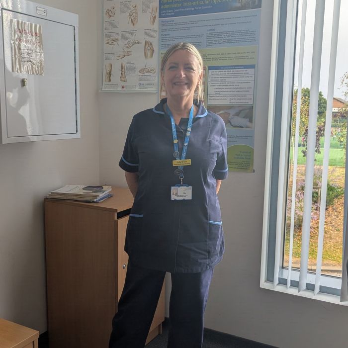 staff member smiling in uniform